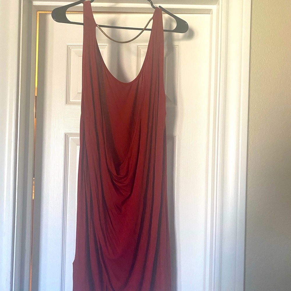 Nice burgundy dress with gold chain attached on the back!